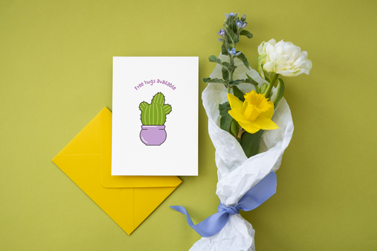 Greeting card with cactus illustration, yellow envelope, and bouquet of flowers on a green background
